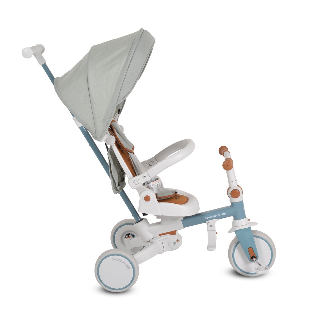 Η φωτογραφία δείχνει Compacto 4 σε 1, Byox – το τρίκυκλο που μεγαλώνει μαζί με το παιδί σας!Το πολυλειτουργικό τρίκυκλο Compacto 4 σε 1 έχει σχεδιαστεί για να προσαρμόζεται στις ανάγκες του παιδιού σας – από τις πρώτες κιόλας βόλτες μέχρι τις πρώτες ανεξάρτητες βόλτες του.