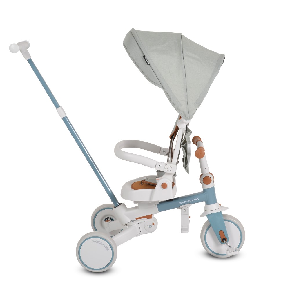 Η φωτογραφία δείχνει Compacto 4 σε 1, Byox – το τρίκυκλο που μεγαλώνει μαζί με το παιδί σας!Το πολυλειτουργικό τρίκυκλο Compacto 4 σε 1 έχει σχεδιαστεί για να προσαρμόζεται στις ανάγκες του παιδιού σας – από τις πρώτες κιόλας βόλτες μέχρι τις πρώτες ανεξάρτητες βόλτες του.