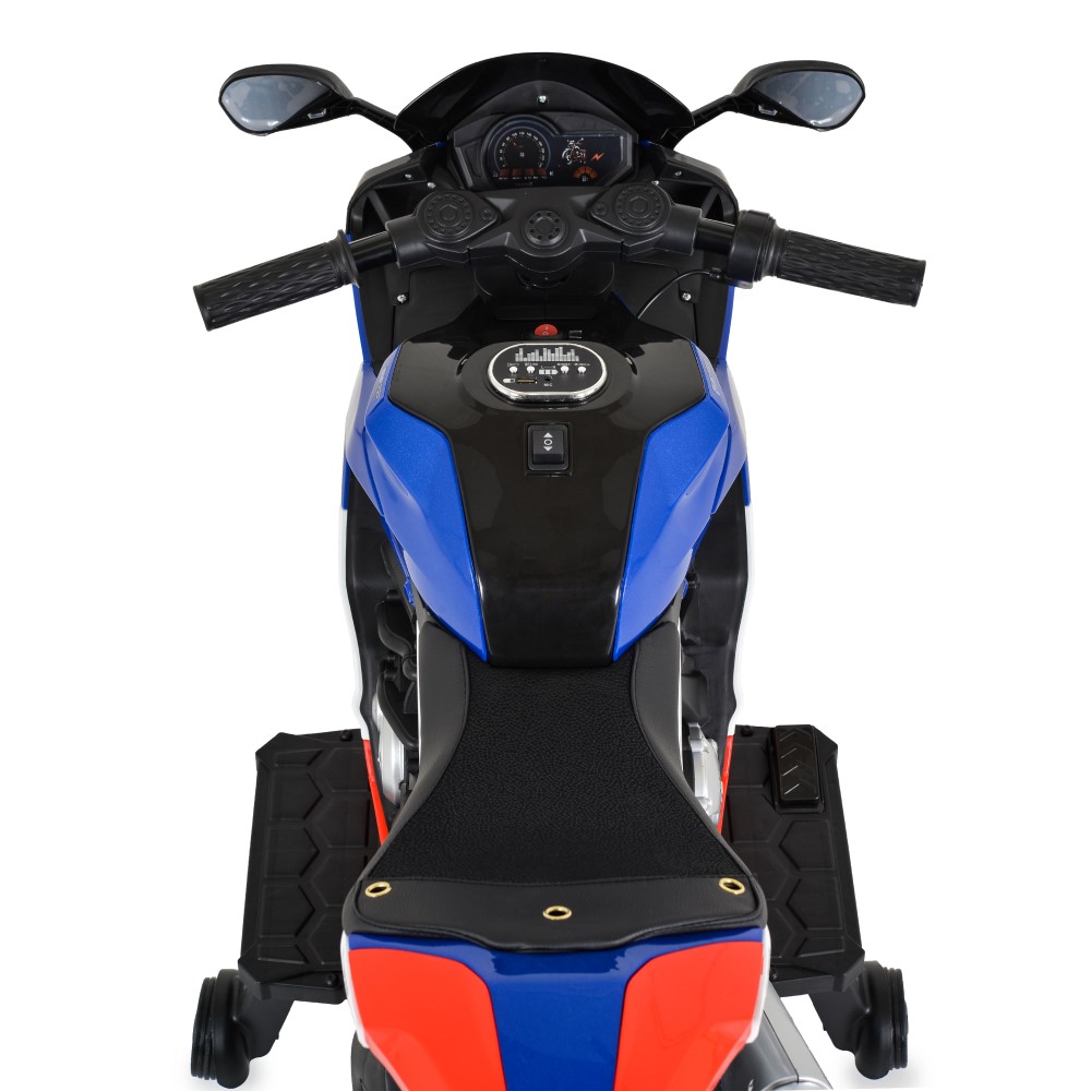 Η φωτογραφία δείχνει Moni, Παιδική Ηλεκτρική Μοτοσικλέτα Surfer για Παιδιά – Για Μικρούς που Αναζητούν την Περιπέτεια!Χαρίστε στο παιδί σας τον ενθουσιασμό της ελευθερίας και του ενθουσιασμού με την Surfer – μια κομψή, ισχυρή και απόλυτα ασφαλή ηλεκτρική μοτοσικλέτα, ειδικά σχεδιασμένη για παιδιά ηλ